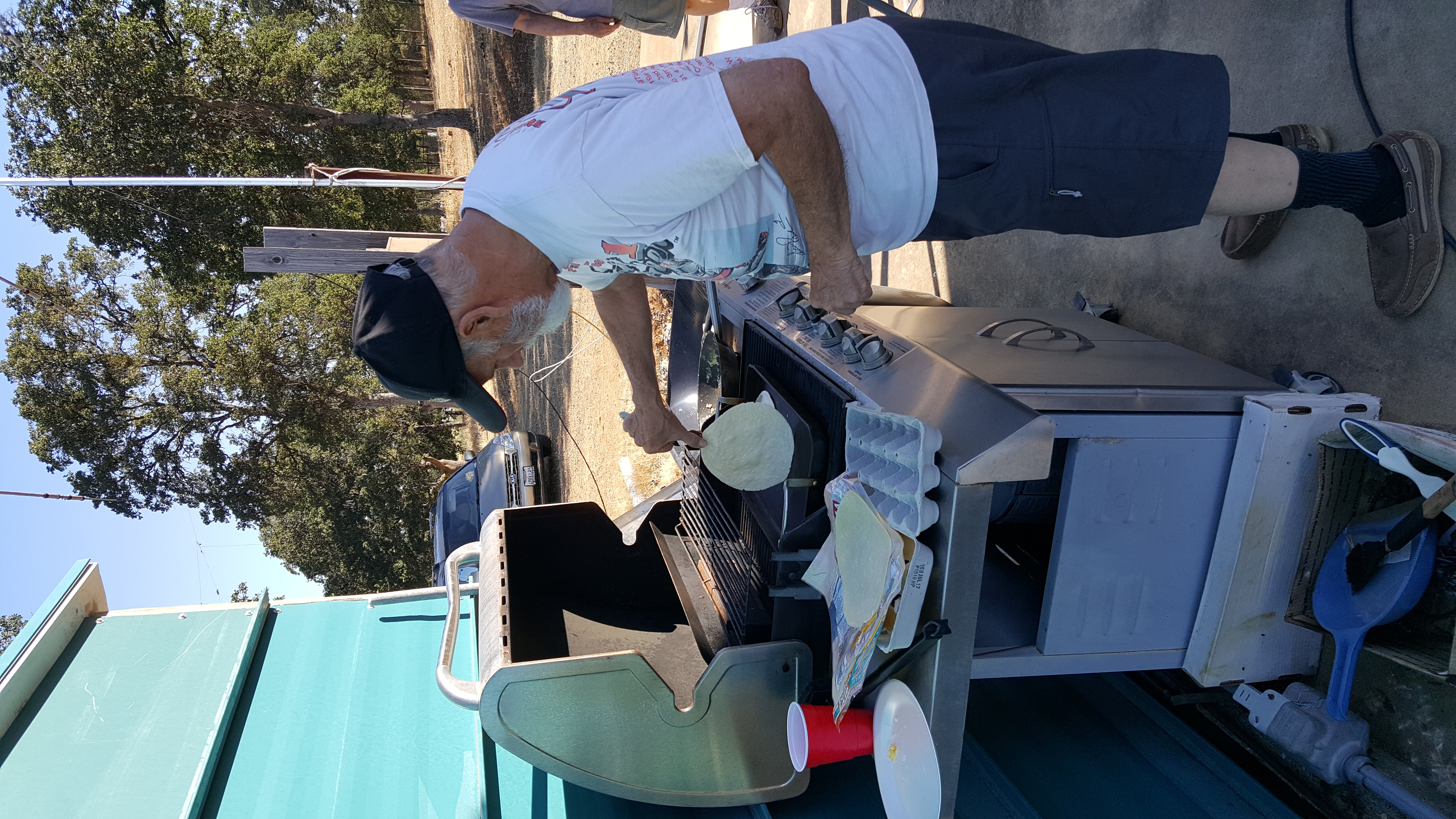 Host Gary IKE flips a tortilla on the BBQ for breakfast