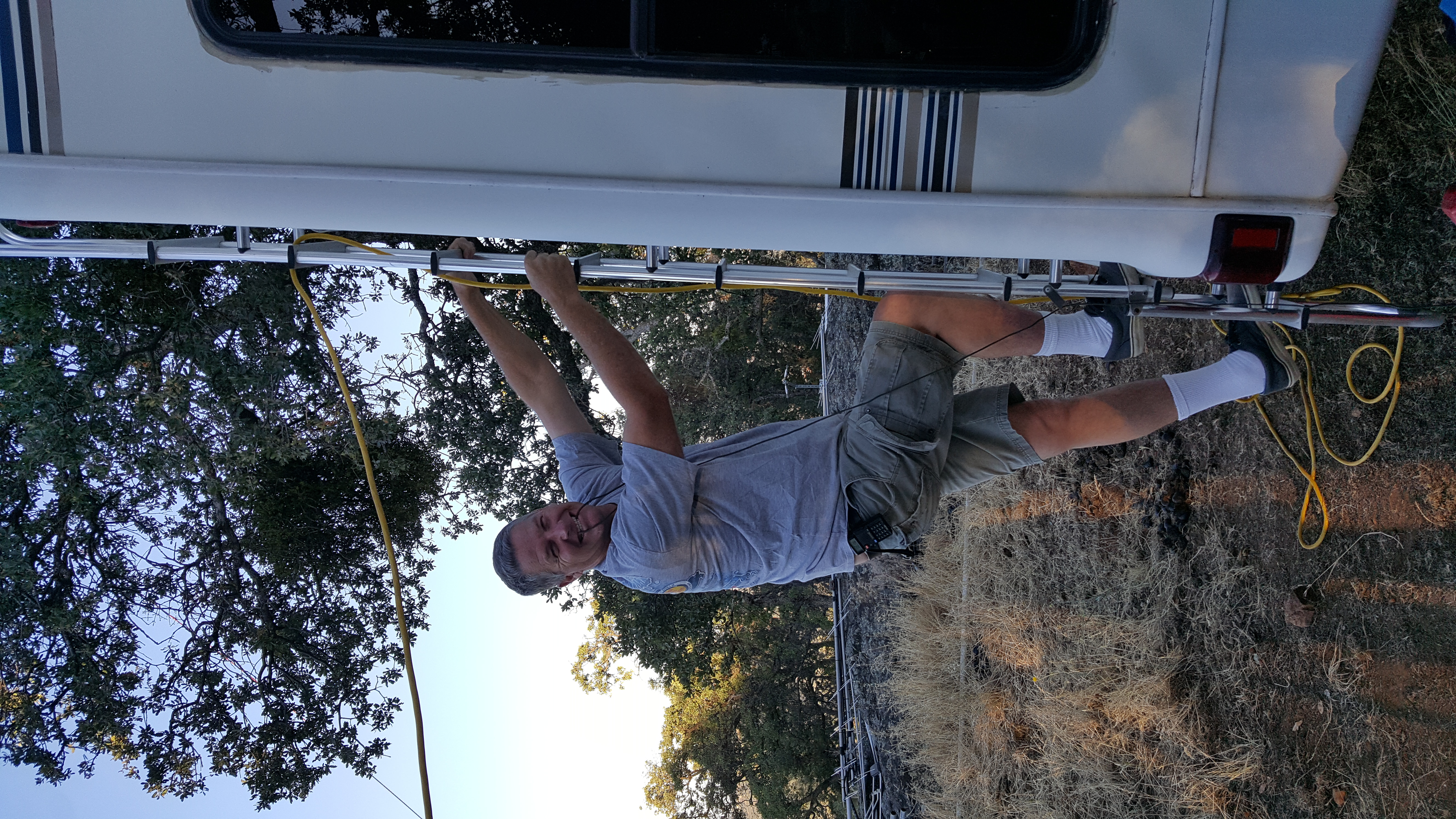 Jerry JKH climbing an RV ladder