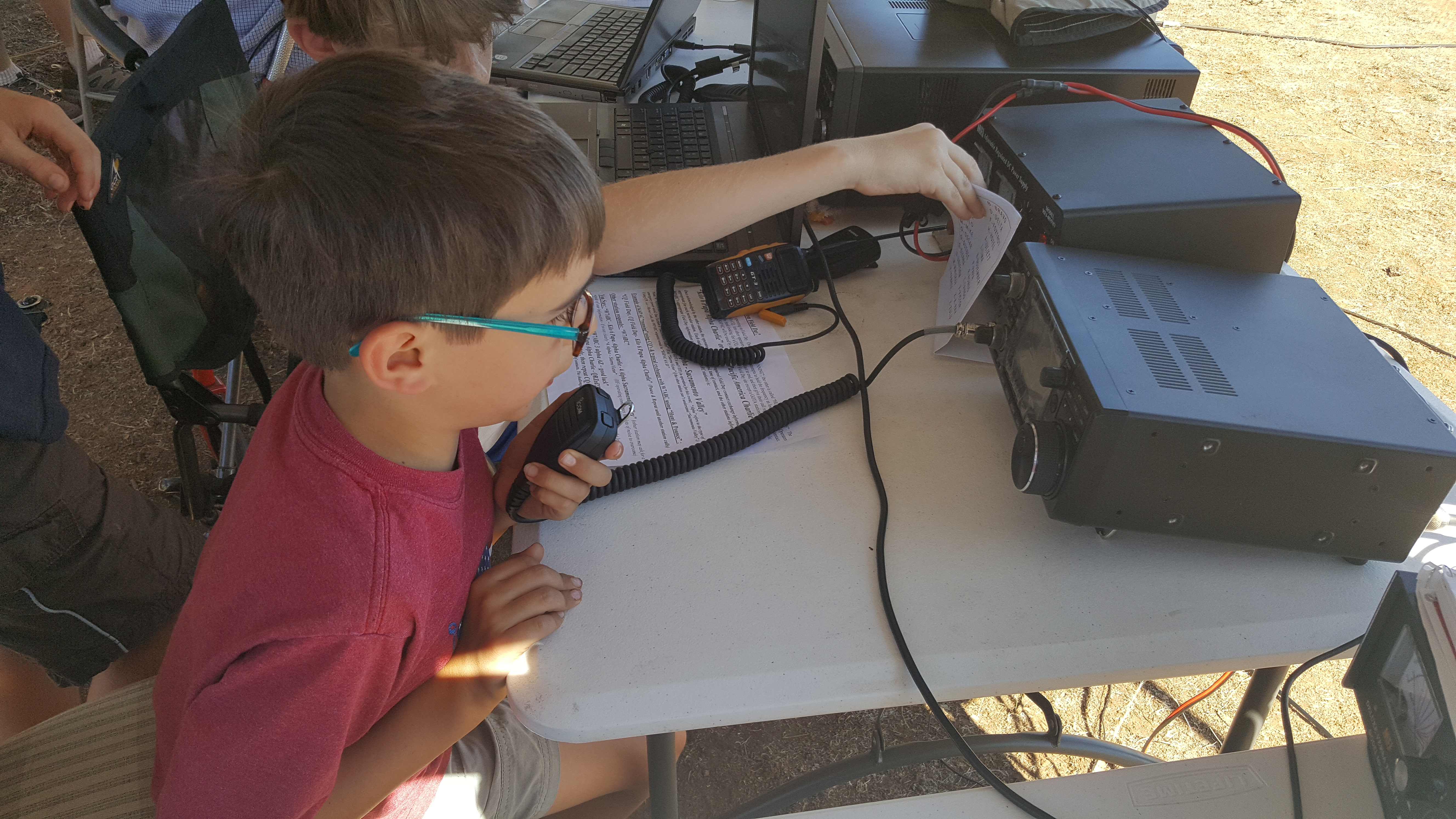 A lad makes voice contacts on Field Day