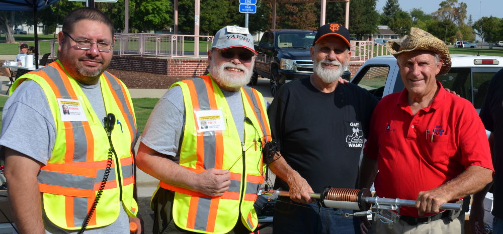 Four Men and a Coil: Art NFM, Michael BUK, Gary IKE and a seller admire a BIG coil