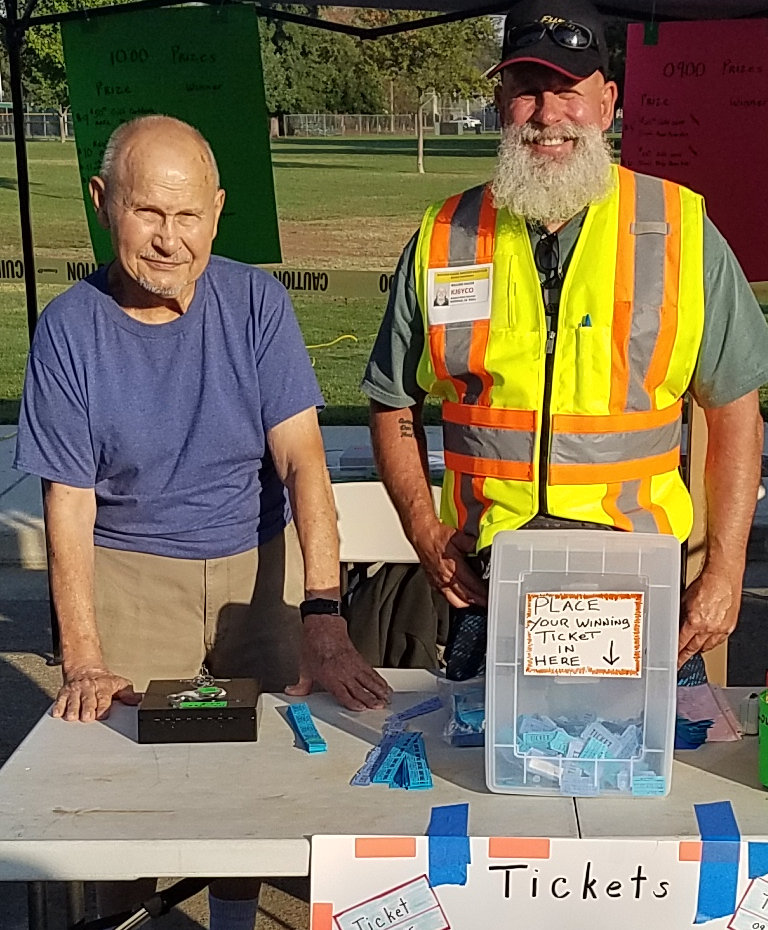 Claire VWG and Bill YCO peddle raffle tickets for fabulous prizes