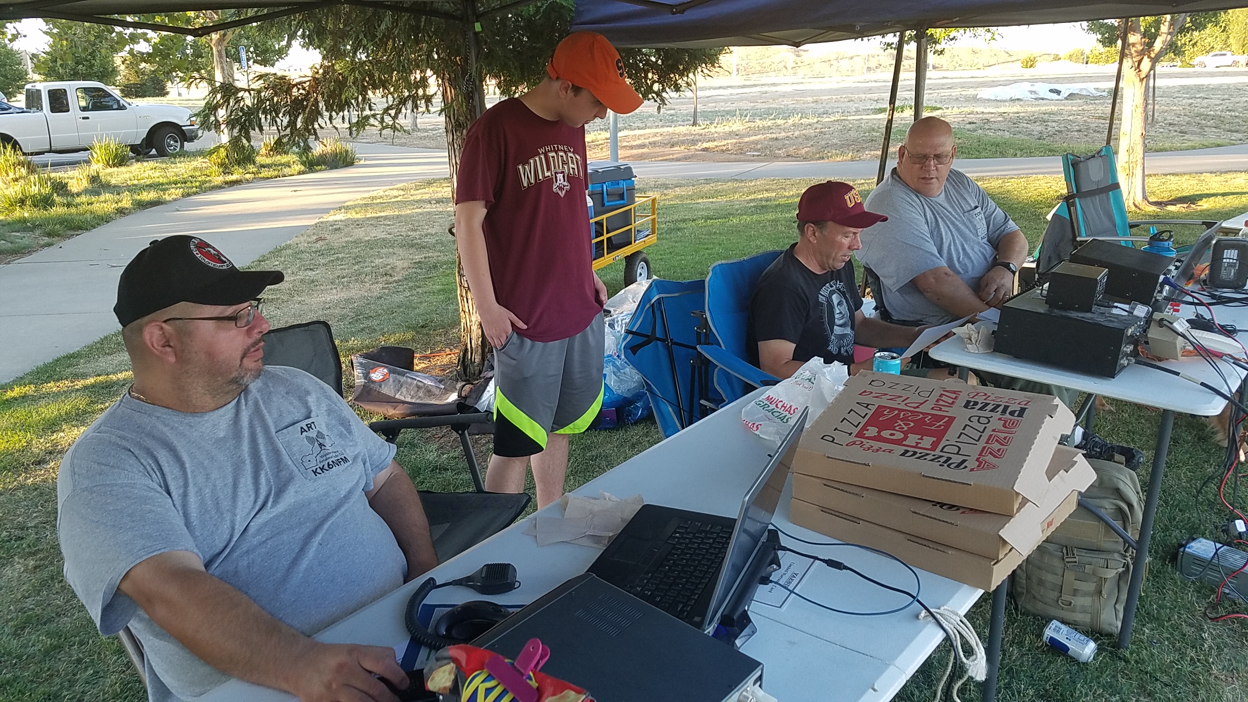 Art NFM and Don DPH at the edges promote ham radio to two visitors